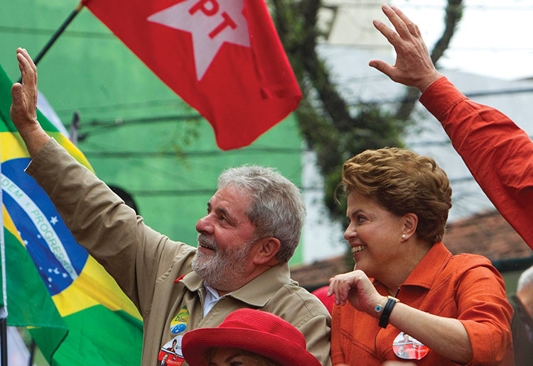 Brazil's President Luiz Inacio Lula da Silva, left, and Workers Party presidential candidate Dilma Rousseff wave to supporters during a campaign rally in Sao Bernardo do Campo, outskirts of Sao Paulo, Brazil, Saturday, Oct. 2, 2010. Brazil will hold general elections on Oct. 3. (AP Photo/Andre Penner)